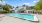 Apartments for Rent in Fort Myers, FL - The Lennox - Pool with Trees Surrounding It