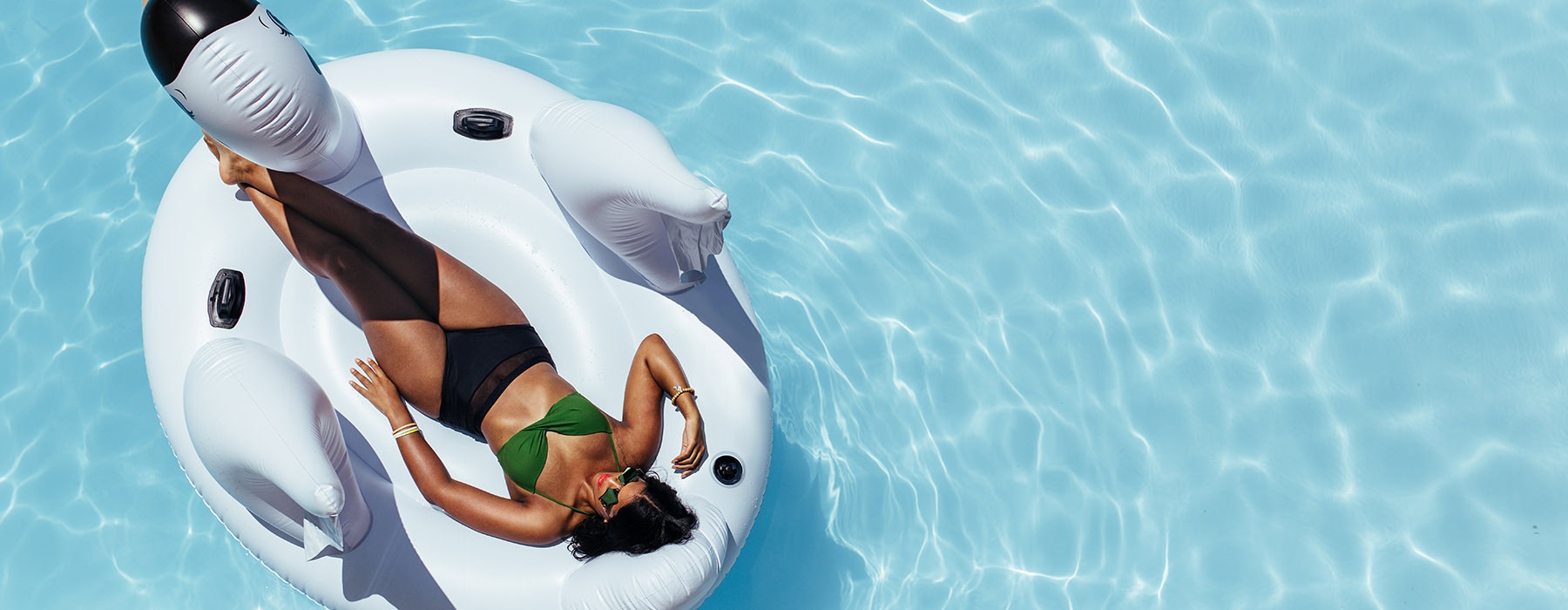 woman on floaty in pool